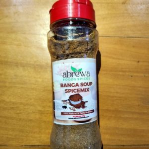 A transparent bottle with a red cap containing a perfect blend of bell peppers, crayfish, and dried palm fruits (banga).